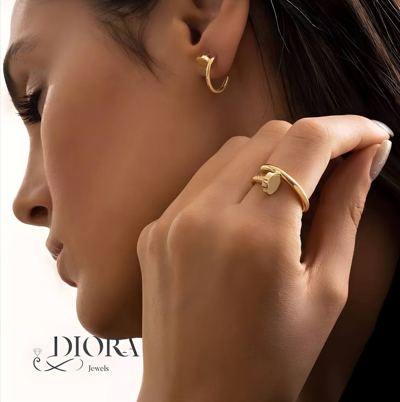 Close-up of a model wearing 18k Gold Knot Earrings showcasing elegance and modern design.