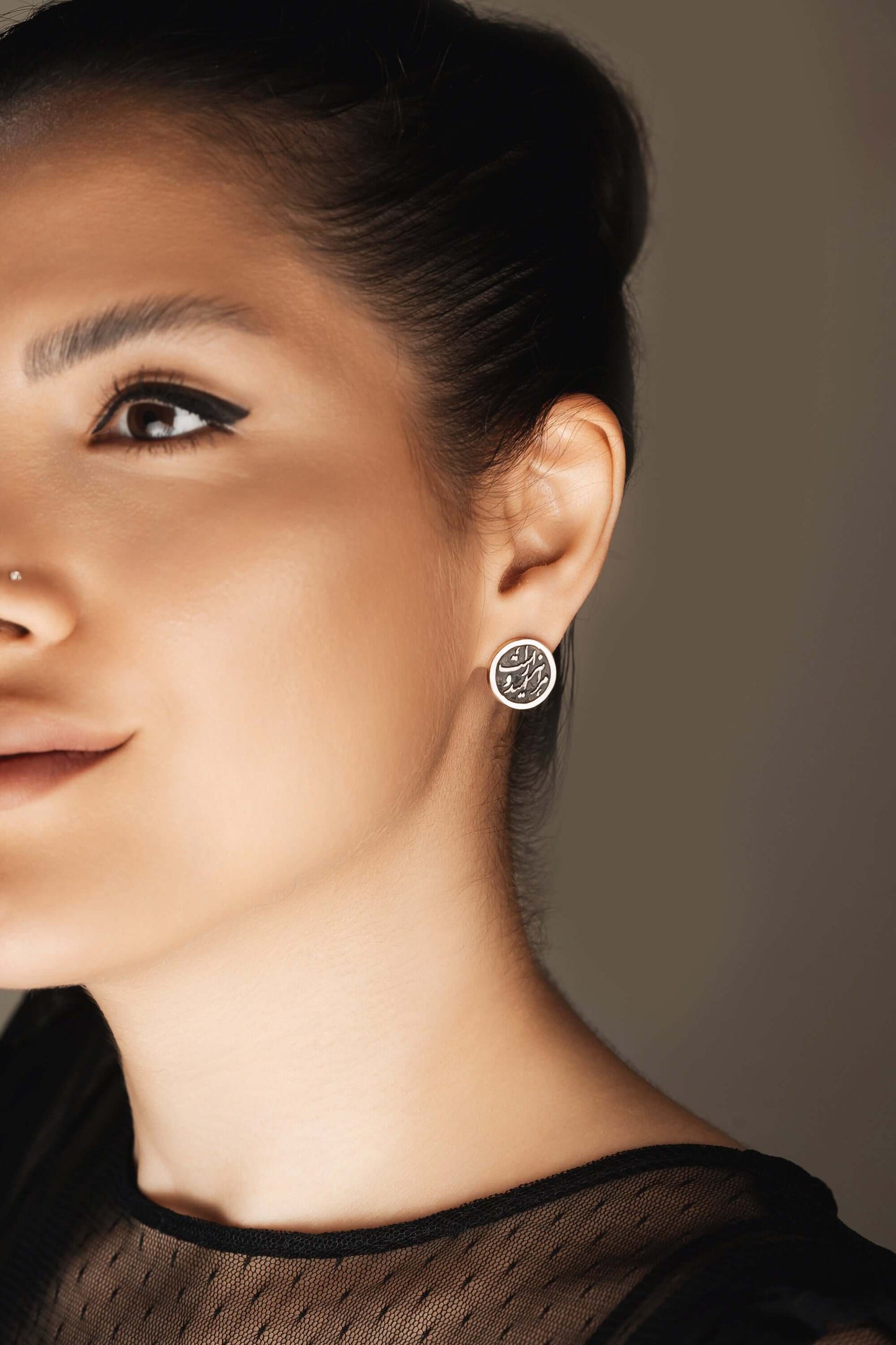 Model showcasing Silver & Gold Stud Earrings, featuring exquisite design and stylish elegance.