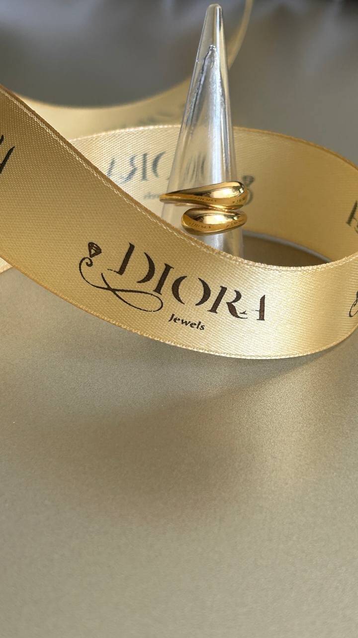 Half Dome Gold Ring showcased with a DIOR ribbon, emphasizing luxury and elegance.
