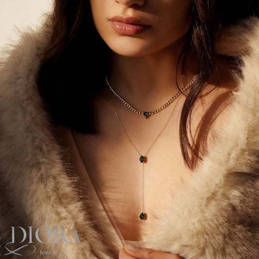 Woman wearing a necklace with a fur coat, featuring the Diora brand.